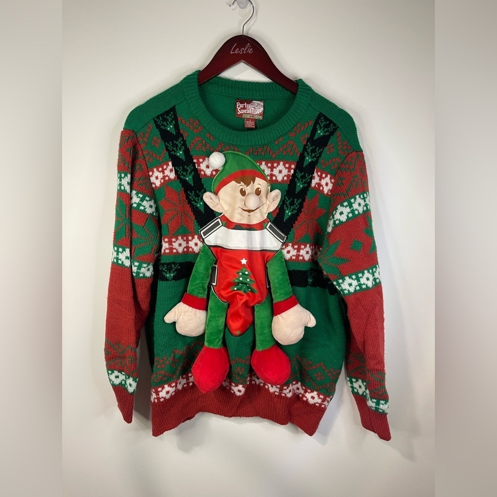 Party sweater dec 25 baby elf with leg and arm.